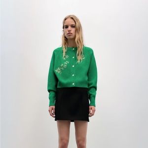Never been worn soft green cardigan with beautiful beaded detail